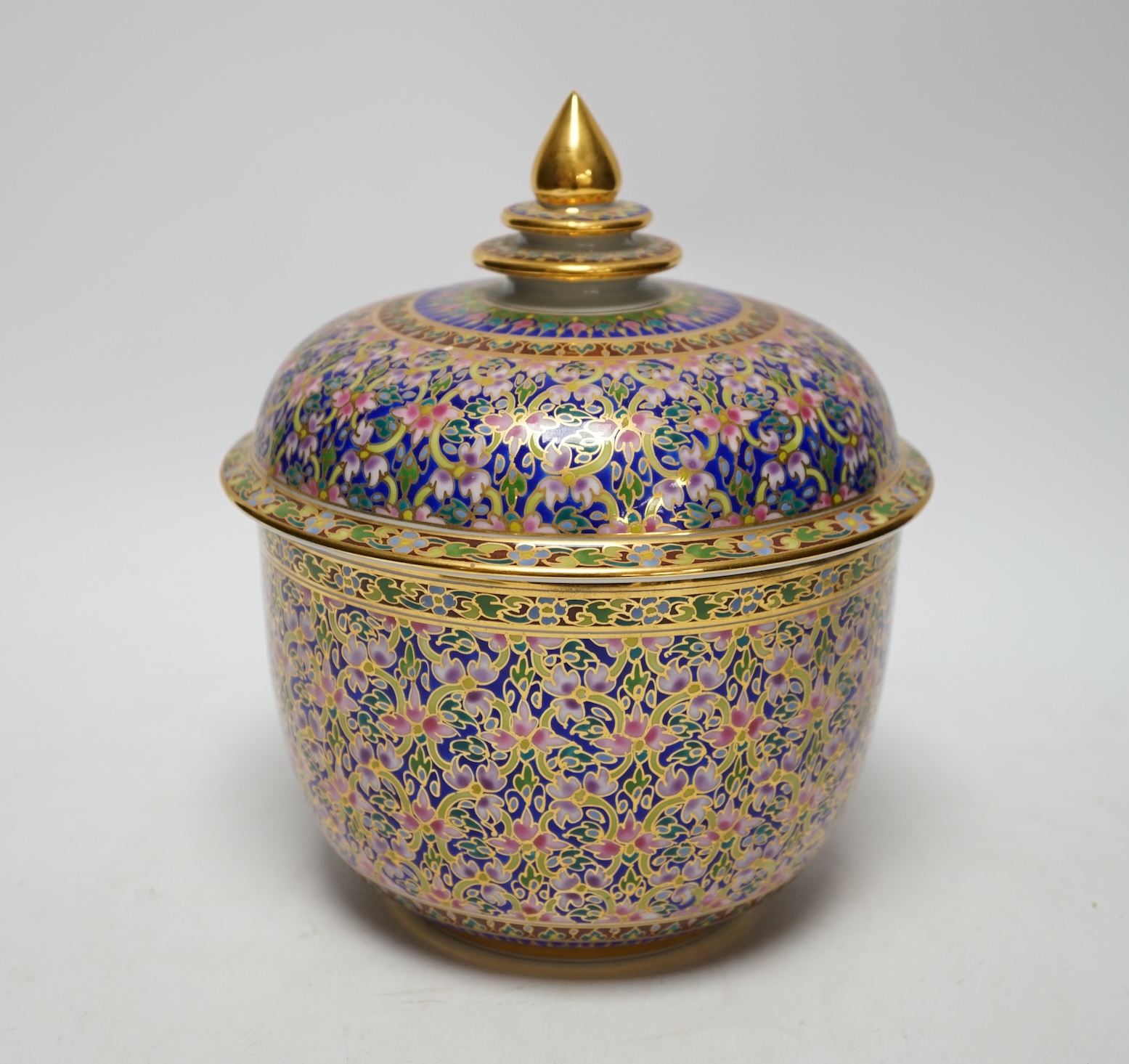 A Continental porcelain bowl and cover enamelled with flowers, 21cm high
